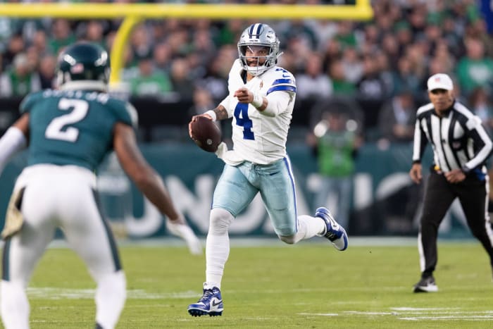Dallas Cowboys quarterback Dak Prescott runs with the ball against the Philadelphia Eagles.